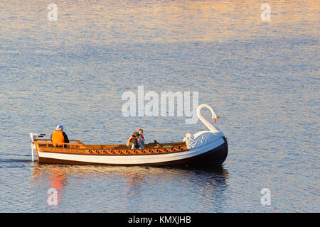 boat in a shape of a swan on a lake Stock Photo