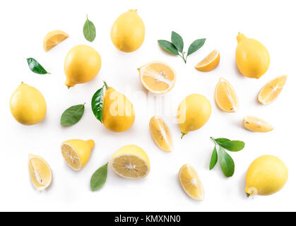 Ripe lemons and lemon leaves on white background. Top view. Stock Photo