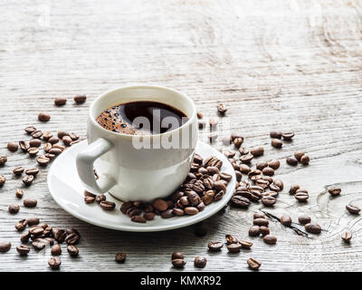 Cup of coffee surrounded by coffee beans. Top view Stock Photo - Alamy