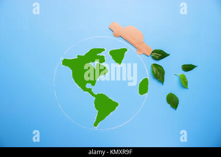 Green planet with paper car. enviromental concept Stock Photo