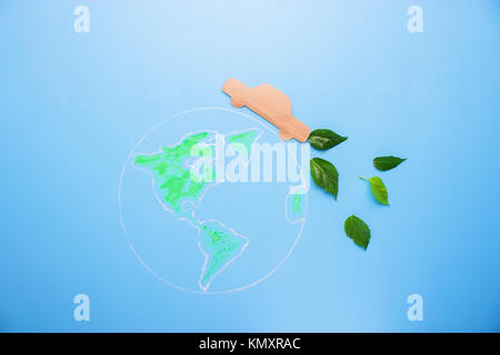 Green planet with paper car. enviromental concept Stock Photo