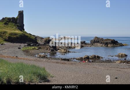 REMAINS OF DUNURE CASTLE AND AILSA CRAIG, AYRSHIRE, SCOTLAND Stock Photo