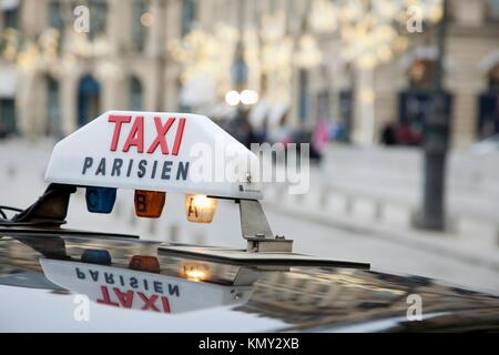 Parisian Taxi with Christmas Decoration in Background