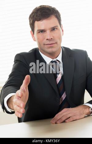 Businessman is going to shake someone´s hand