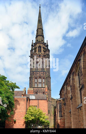 Tower & Spire of Coventry Old Cathedral viewed from behind St Mary's Guildhall Stock Photo