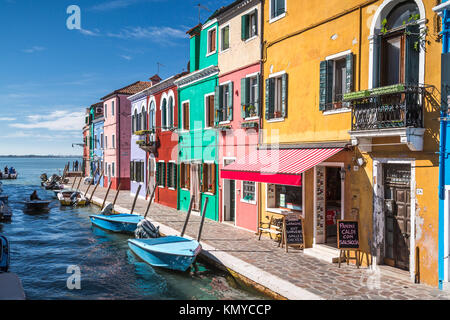The colorful buldings, canals and boats in the Venetian vlllage of Burano, Venice, Italy, Europe. Stock Photo