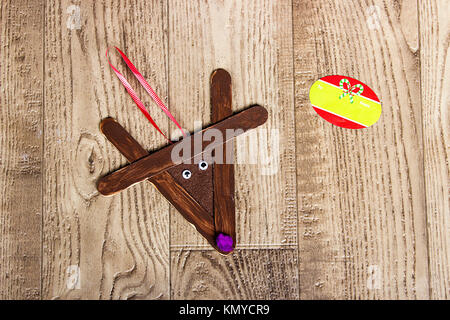 hand made christmas ornaments from popsicle sticks, kids crafts, popsicle sticks,reindeer globe Stock Photo