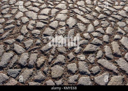 Surface of an old cobblestone road Stock Photo