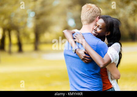 Couple in love hugging peacfully outdoors Stock Photo