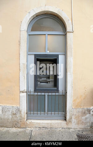 Automated Teller Machine in Arch Window Stock Photo