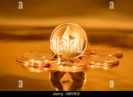 Golden coins with the symbol of the digital crypto currency Ethereum Stock Photo