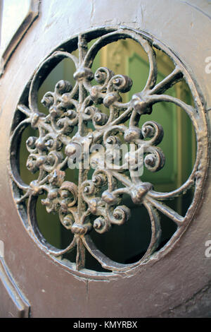 Wrought Iron Porthole on Door Stock Photo