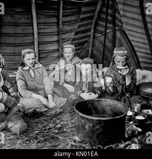 Sami women in their hut drinking coffee, Finland Stock Photo