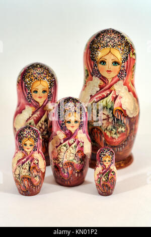 Pretty Matryoshka Doll with Floral Ornaments - Traditional Russian Stacking Doll - Set of 5 pcs on a white background. Handmade in Russia Stock Photo