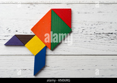 wooden tangram in a bomb shape Stock Photo