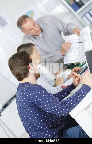 talented young architects watching professional master class Stock Photo