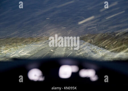 Driving a car  in heavy snow Stock Photo