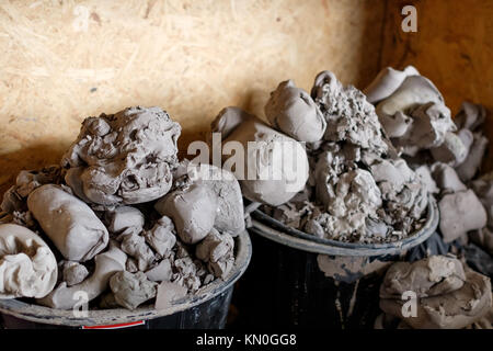 A lot of pieces of gray clay for modeling in basket Stock Photo