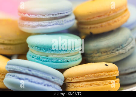 Close up of colorful french dessert macarons on a plate. Stock Photo