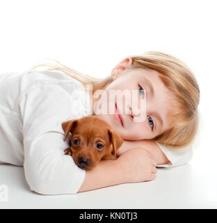 blond kid girl with mini pinscher pet mascot dog on white background ...