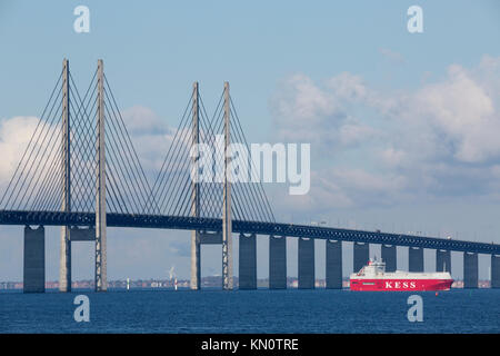 Commercial vessel passes The Øresund Bridge Stock Photo