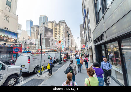 NEW YORK - JUL 22: 7th avenue with traffic and commercials on July 22, 2014 in New York. Seventh Avenue is a thoroughfare on the West Side of the boro Stock Photo