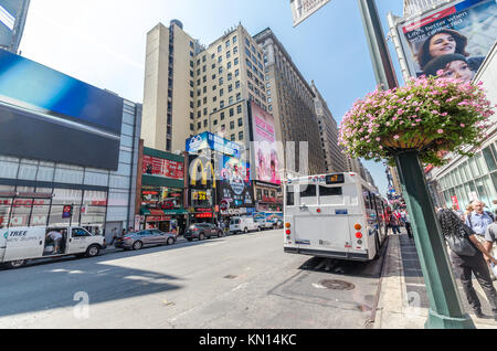 NEW YORK - JUL 22: 7th avenue with traffic and commercials on July 22, 2014 in New York. Seventh Avenue is a thoroughfare on the West Side of the boro Stock Photo