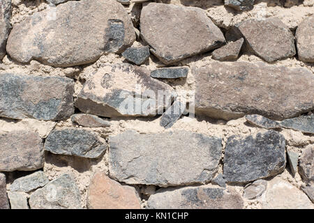 Fort solid stone wall texture with sand sandwich texture wet soil reserves used for construction and for decoration purpose grey color big and small Stock Photo