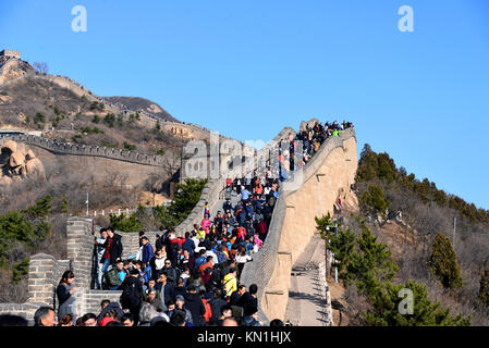 Beijing, China - November 11, 2017:  A large crowd of people visit the world famous Great Wall of China on a sunny day. Stock Photo