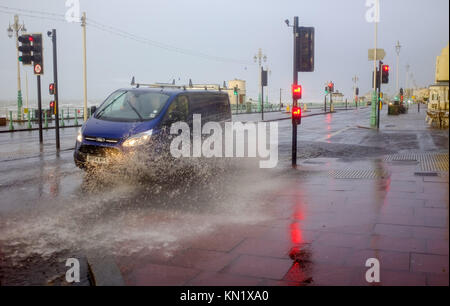 Brighton, UK. 10th Dec, 2017. Surface water on the seafront road in Brighton this morning as high winds and rain battered the south coast . Many parts of Britain are being hit by heavy snow falls today and more is forecast over the next few days Credit: Simon Dack/Alamy Live News Stock Photo