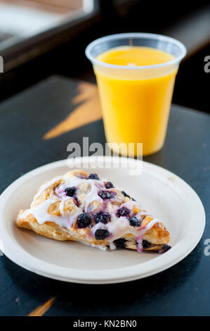 Food Breakfast USA blueberry scone and orange juice on a restaurant table Stock Photo