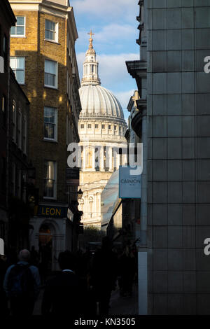 View of St Paul's Cathedral along Watling Street, a narrow historic street in the City of London, UK Stock Photo