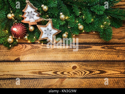 Christmas holidays background with Christmas trees light and red candle Stock Photo