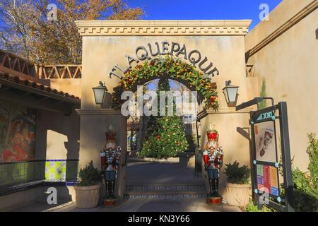 Entrance Gate to Trendy Tlaquepaque Outdoor Spanish Arts and Crafts Village with decorated Christmas Tree in the Background Stock Photo