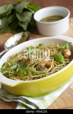 Spaghetti with king prawns and classic basil pesto sauce.