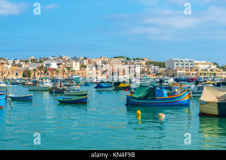 panoramic aerial skyline view to european harbor with village Marsaxlokk and traditional colorful Luzzu fishing boats, Malta Stock Photo