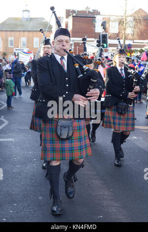 Man playing the bagpipes in traditional kilt and uniform Stock Photo