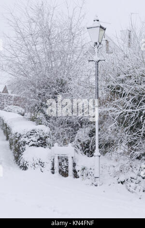 Village in the English countryside covered in snow Stock Photo