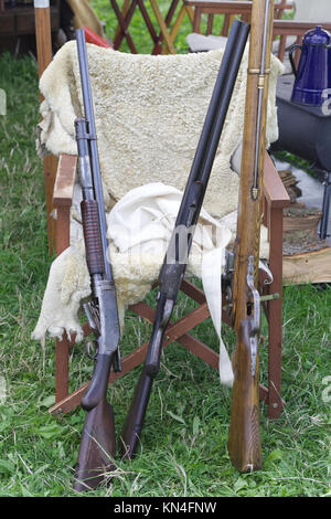 Three flintlock riffles at a wild west reenactment Stock Photo