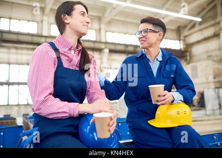 Machine Operators Taking Break From Work Stock Photo