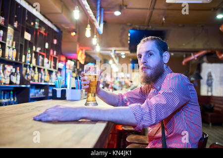 Contemporary  Young Man Chilling in Bar Stock Photo
