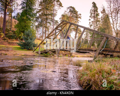 The bridge over Marshall’s Lake at Bedgebury National Pinetum and Forest on the Sussex/Kent border. Stock Photo