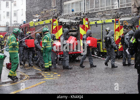 Members of the police, fire brigade and ambulance service during a joint exercise to test their response to a 'HAZMAT' type ncident involving a hazardous substance, at the Israeli Embassy in Kensington, London. Stock Photo