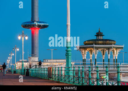 NIght falls on Brighton seafront, UK. Victorian Bandstand and i360 tower in the distance. Stock Photo