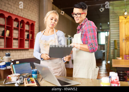 Two Artists Planning Project in Studio Stock Photo