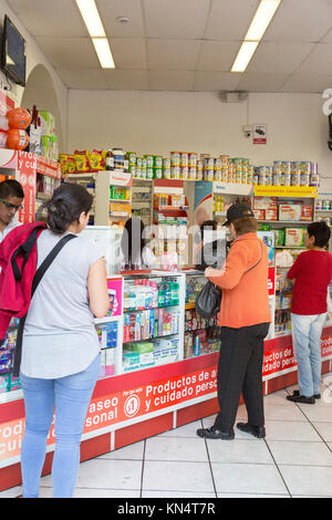 Ecuador pharmacy - local ecuadorian people shopping in a chemist shop or pharmacy, Quito, Ecuador South America Stock Photo