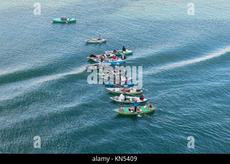 El Qantara, Egypt - November 5, 2017: Fishermen in wooden boats on the Suez Canal in Egypt. Stock Photo