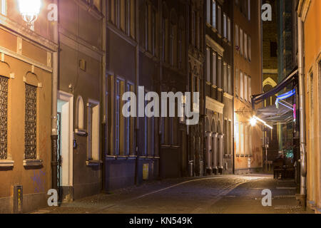 View of the lit Kaletnicza Street and St. Mary's Church at the Main Town (Old Town) in Gdansk, Poland, in the evening. Stock Photo