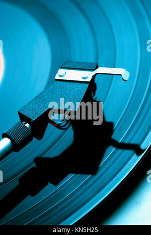 vinyl music record playing on a retro turntable Stock Photo