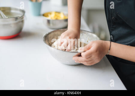 Bakery chef cooking bake in the kitchen professional Stock Photo